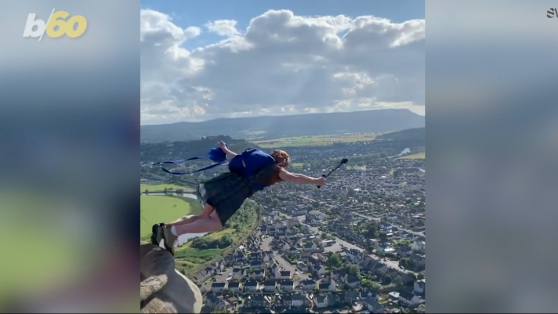 Thrill-seekers Dressed in Kilts Base Jump From the Top of the William Wallace Monument in Stirling