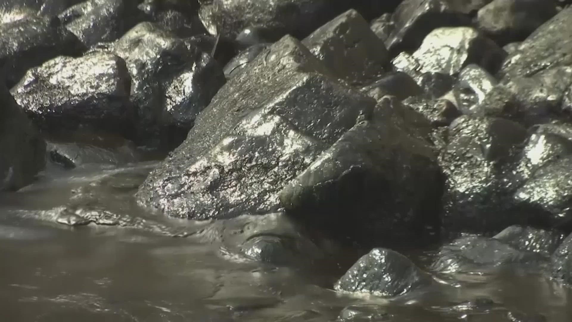 Environmental authorities worked to clean oil from a beach in Lima after a spill attributed to high waves caused by the eruption of a volcano in Tonga.