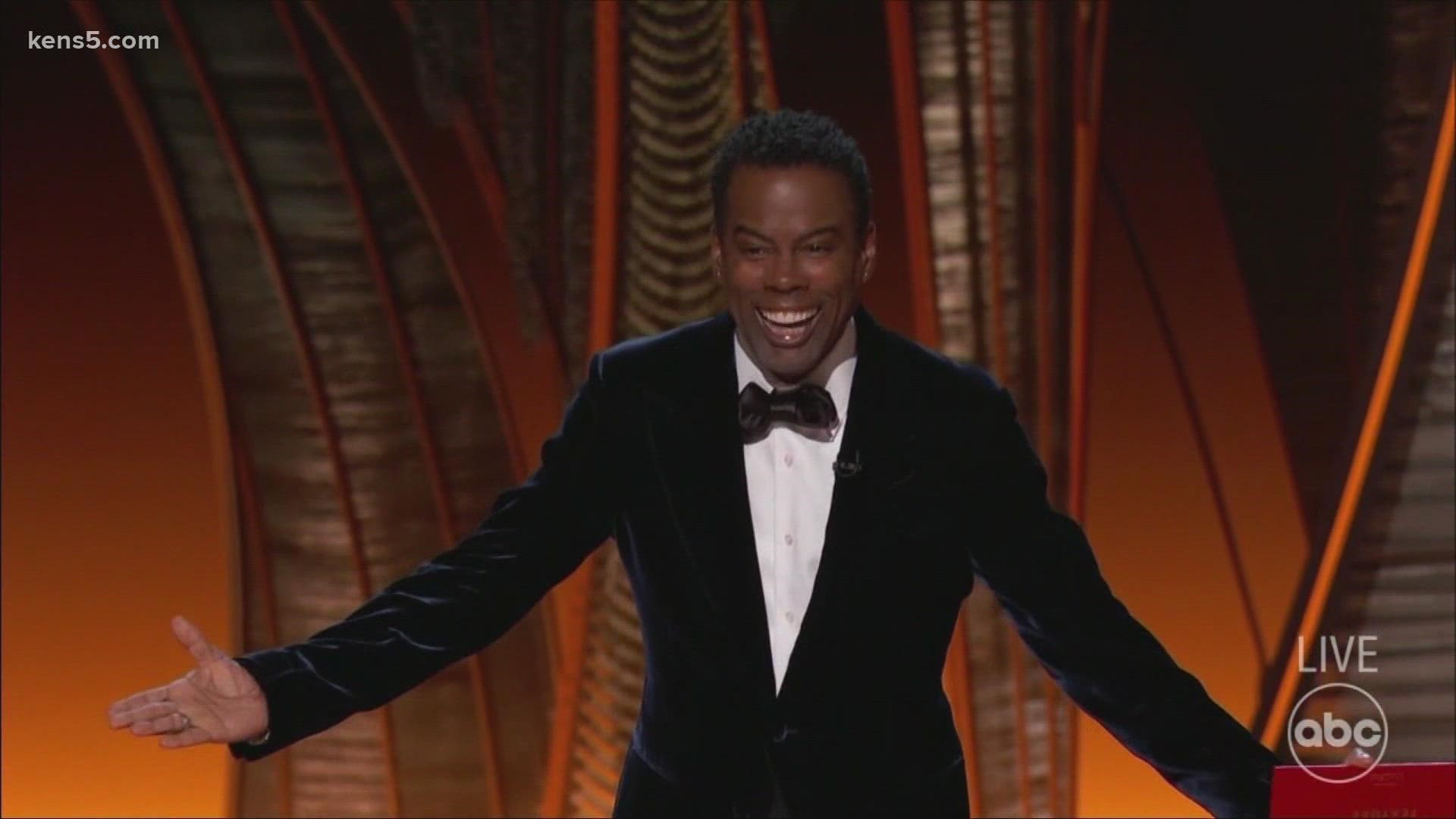 Smith got out of his seat after Rock made a joke about his wife. He later apologized, saying, "Love will make you do crazy things."