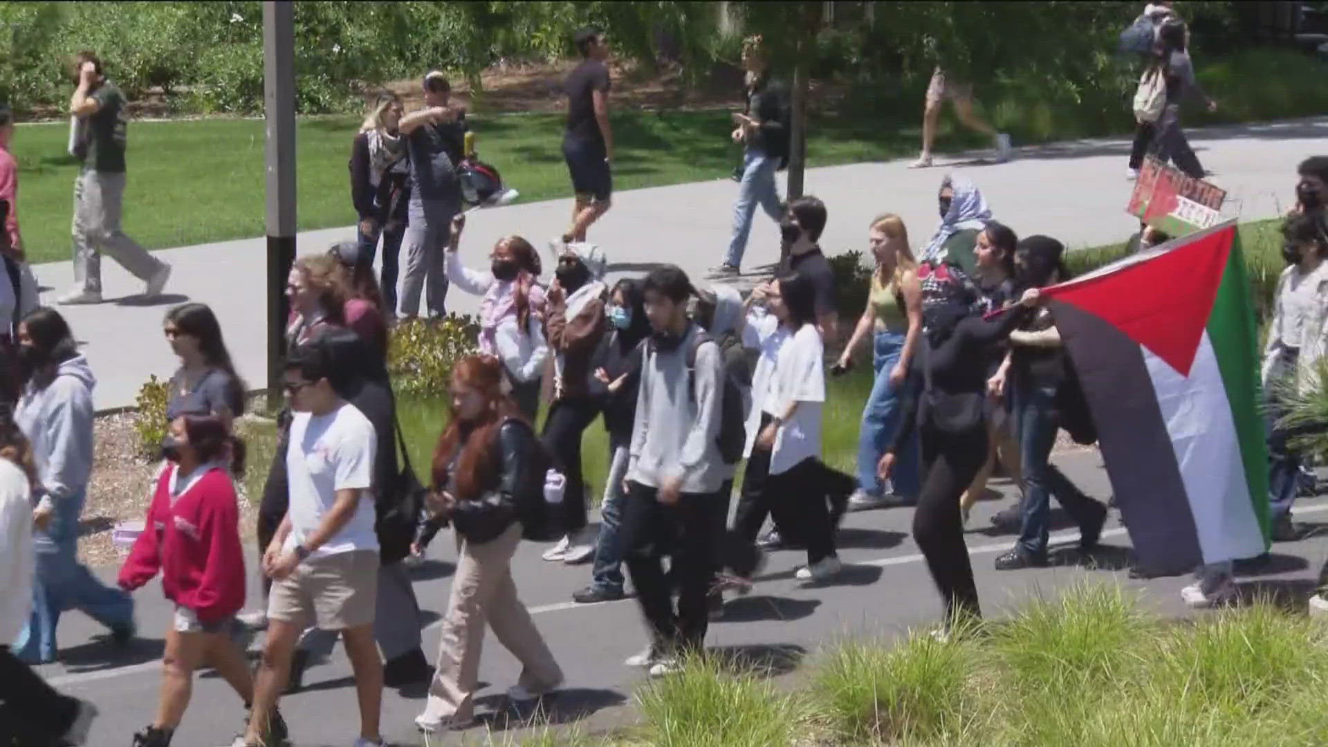 About 1,000 protesters gathered Wednesday afternoon at Sungod Lawn and peacefully marched through the heart of the UC San Diego campus.