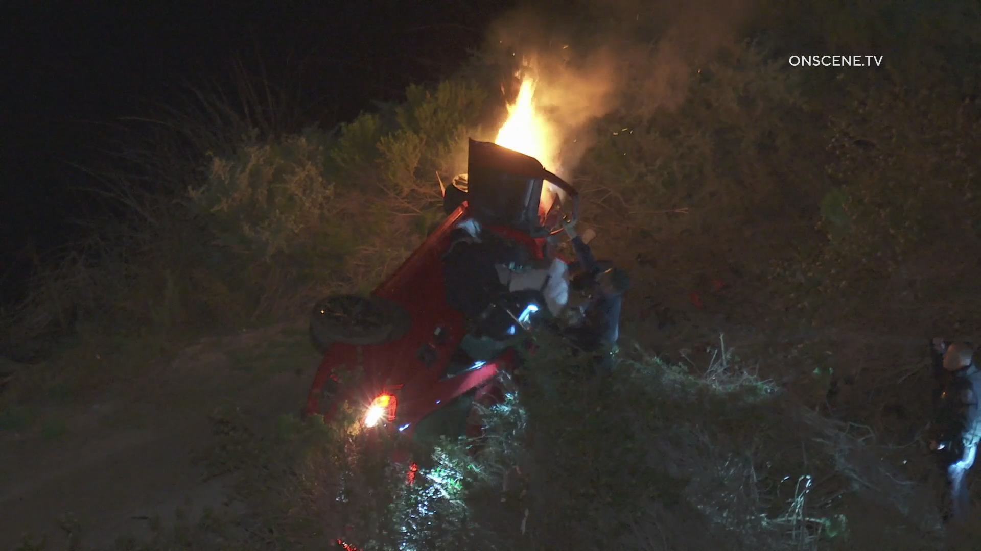 After hitting a spike strip, the car went off the freeway, down an embankment where it caught fire. CHP Officers rescued the man from the burning car.