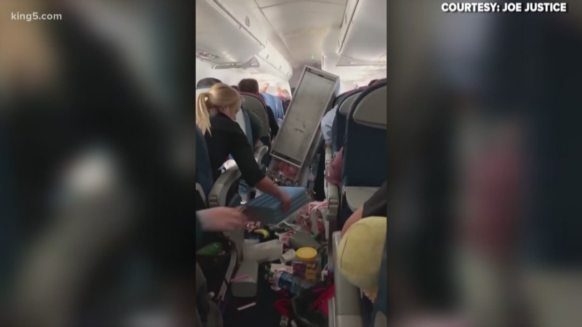 Two passengers and a flight attendant were hospitalized after a Seattle-bound flight made an emergency landing in Reno.