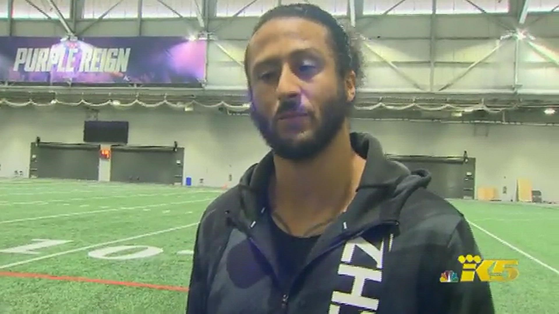 Free agent Colin Kaepernick works out with Seahawks receiver Aaron Fuller in Seattle on Wednesday.  Kaepernick says he hopes the door is still open with the Hawks.