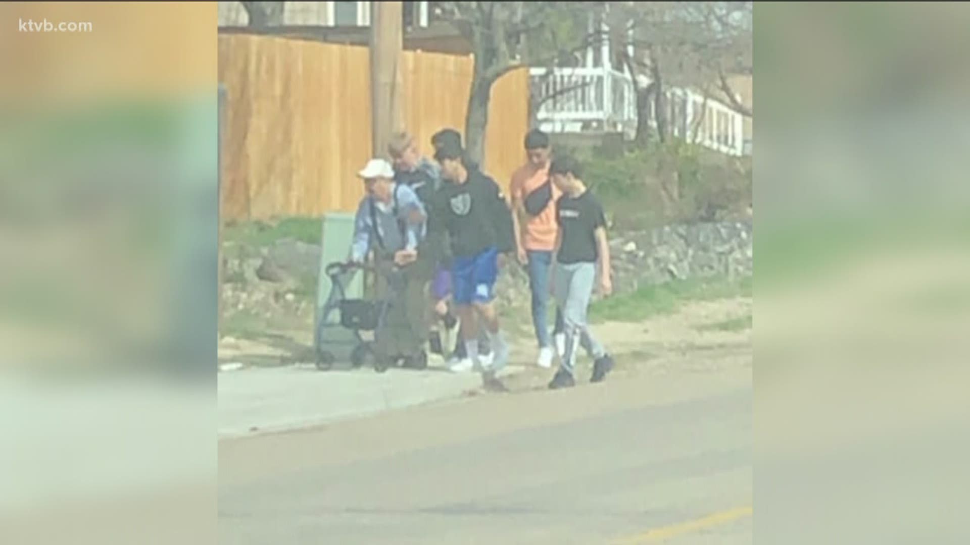 Teenagers in Caldwell saw an elderly man fall down on the sidewalk and they immediately went to help him, and photos of them walking him back to his house quickly went viral on Facebook.