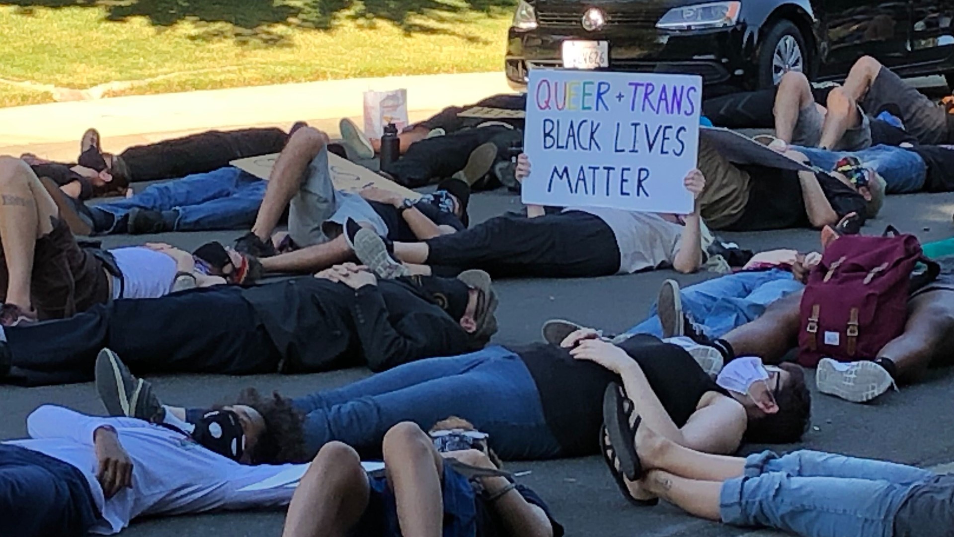 A day after an officer shot a man near Sacramento State, protesters laid down body bags in front of the Sacramento city manager's home to protest police shootings.