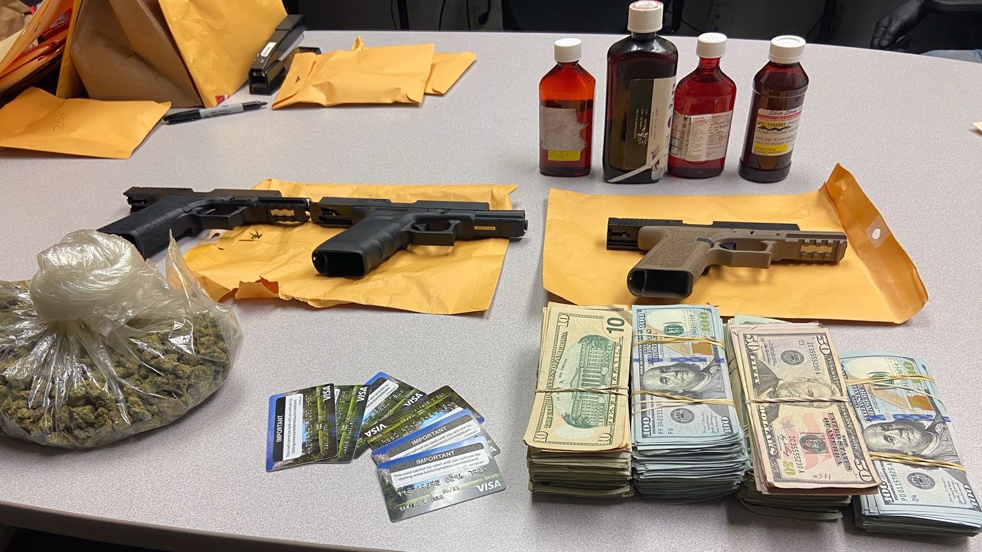 Torrance Police said officers recovered more than 130 EDD cards loaded with over $150,000 and four handguns, two of which did not have serial numbers.