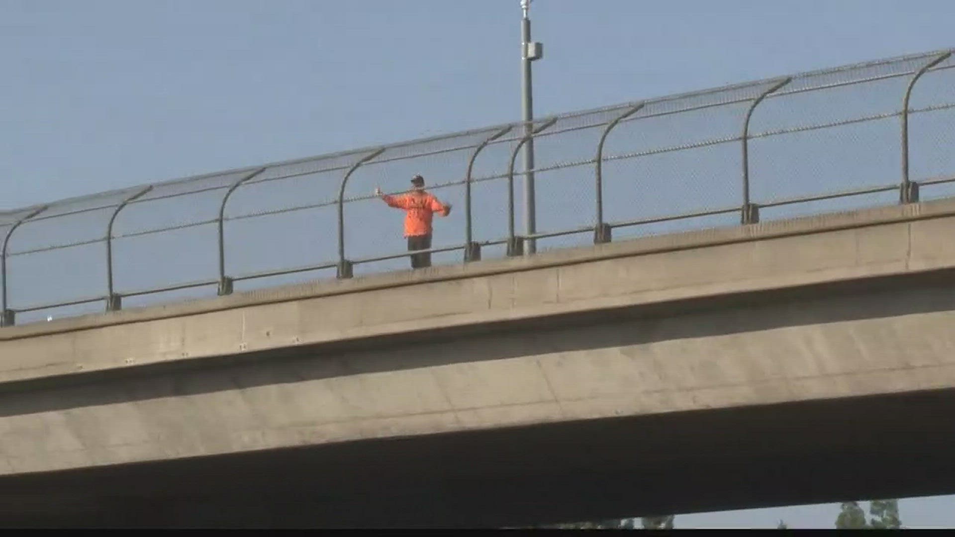 You may have seen him standing on an overpass in Sacramento.