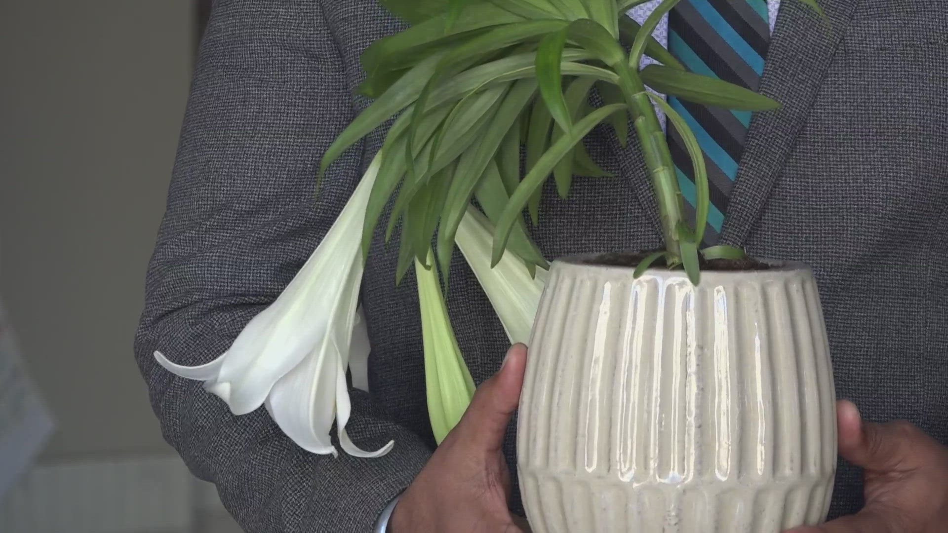 Peace lilies were handed out by members of the SF Zion Church a week after a shooting hurt two at a Sikh temple in Sacramento.