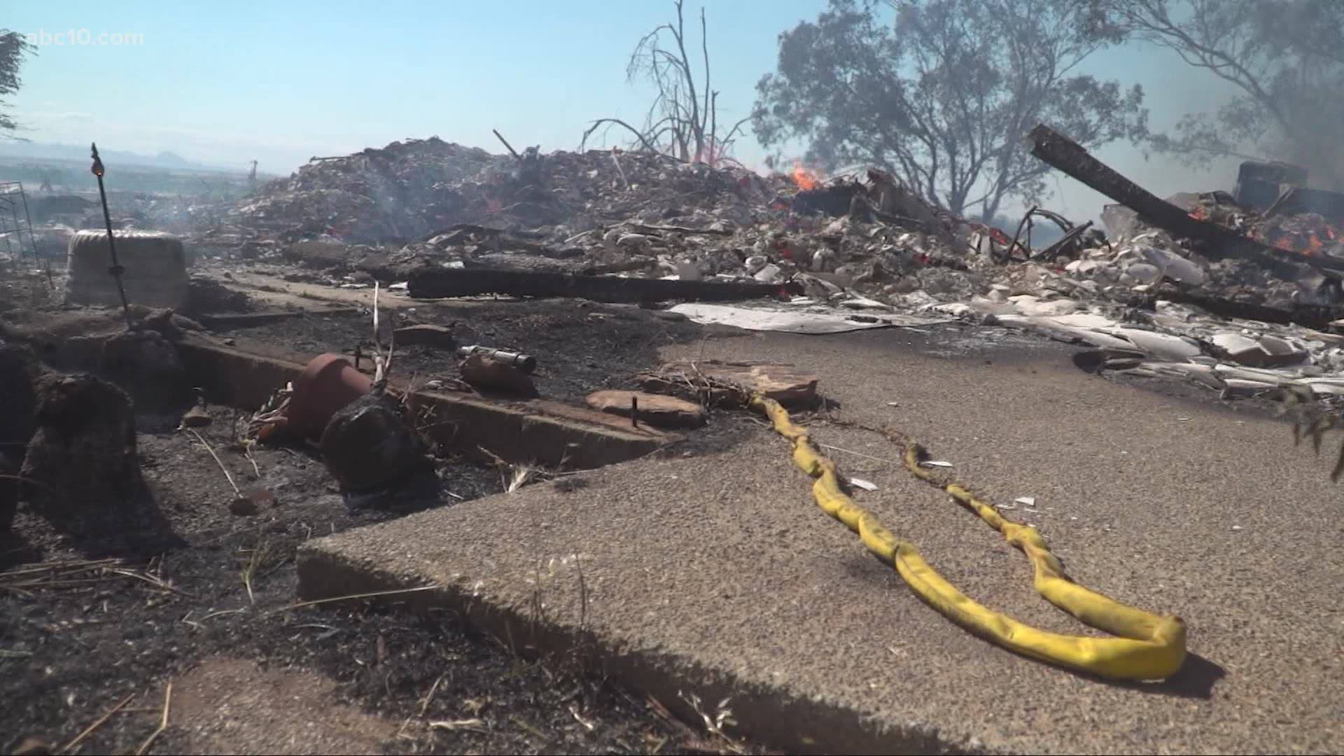 A wildfire near Beale Air Force Base in Yuba County burned at least 900 acres and destroyed at least one home Tuesday afternoon.