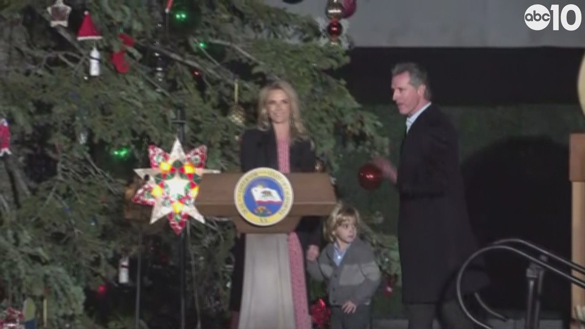California Gov. Gavin Newsom and his wife light the Capitol Christmas Tree with the help of a Gilroy girl with Down syndrome (Associated Press).