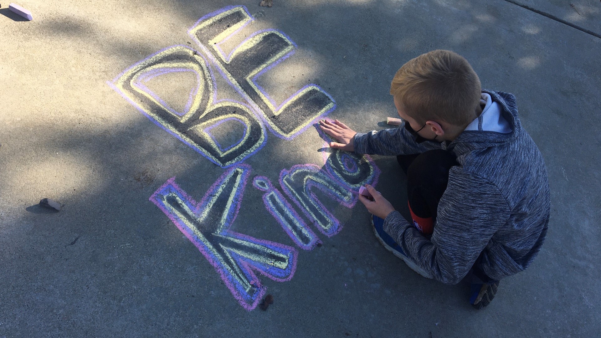 "Spread Love, Not Hate" event brought community members to transform racist graffiti into messages of love.