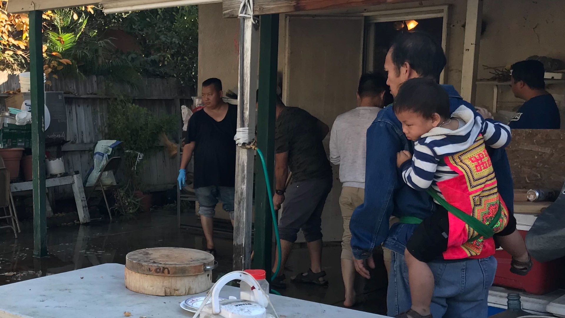 A Fresno family was left in mourning after police say two suspects fired into a crowd during a backyard football watching party.