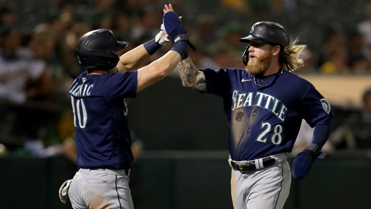 Mariners beat Athletics 5-2 to stay in AL wild-card chase