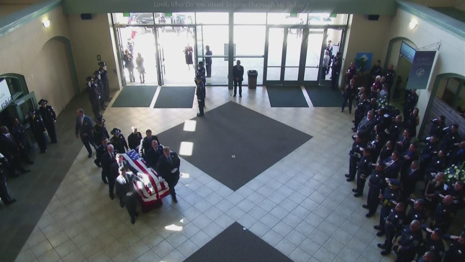 The family of fallen Sacramento Police Officer Tara O'Sullivan and her casket arrive at her memorial service in Roseville, California.