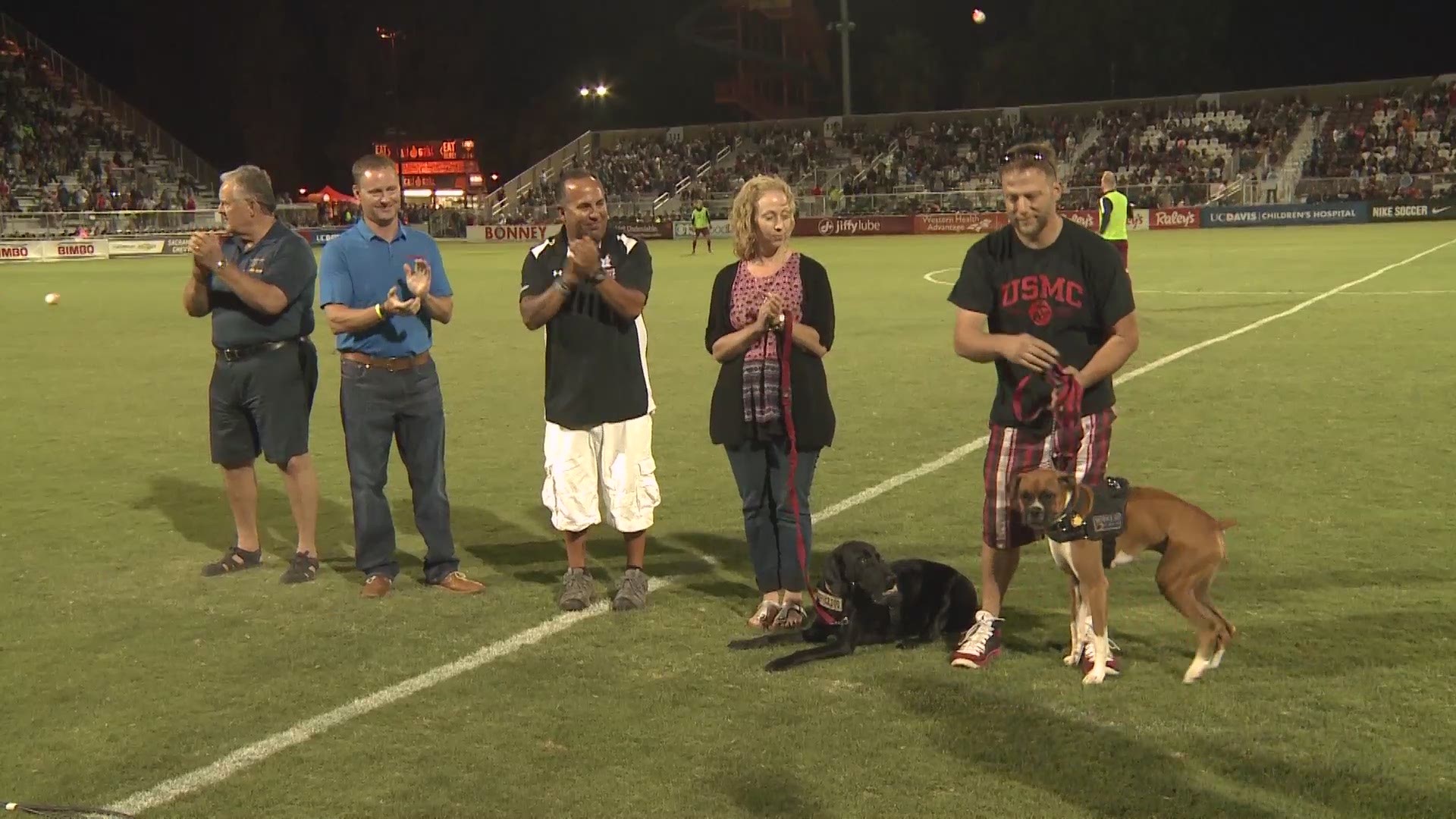 Veteran Cory Davis was presented with a service dog from The Honor Group at a Sac Republic game