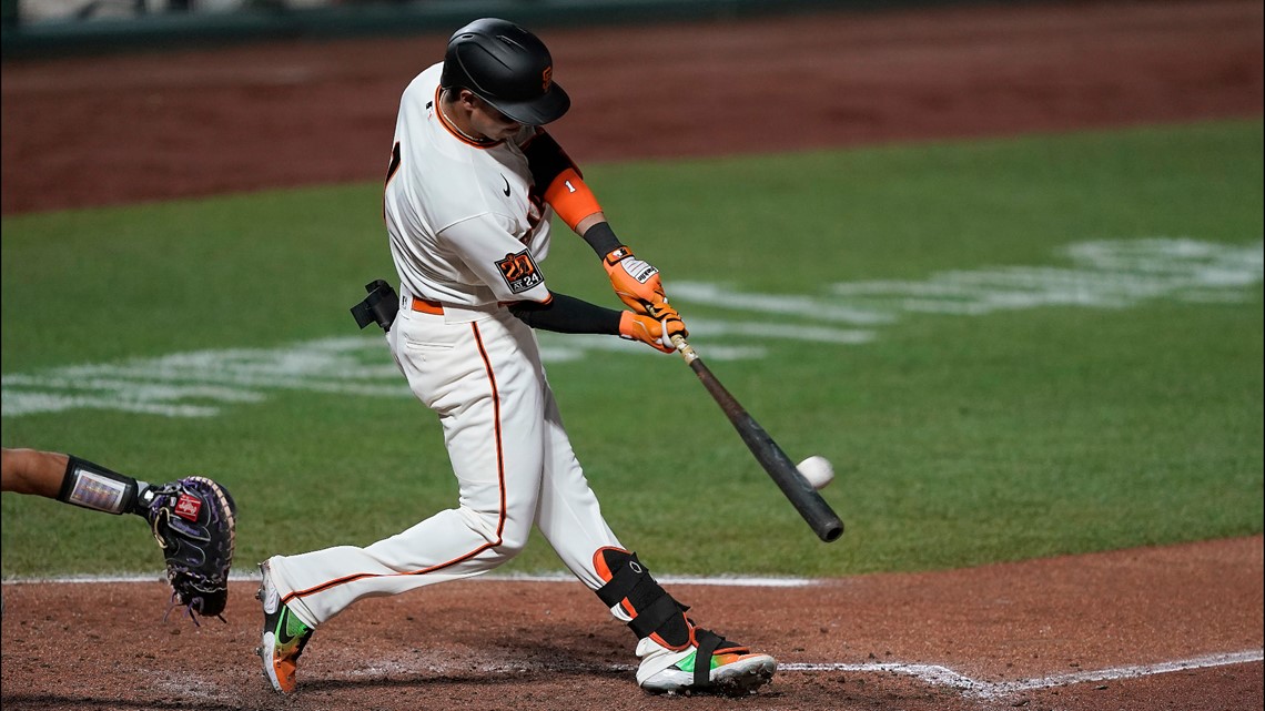 Giants visit Rockies with wild-card hopes still alive