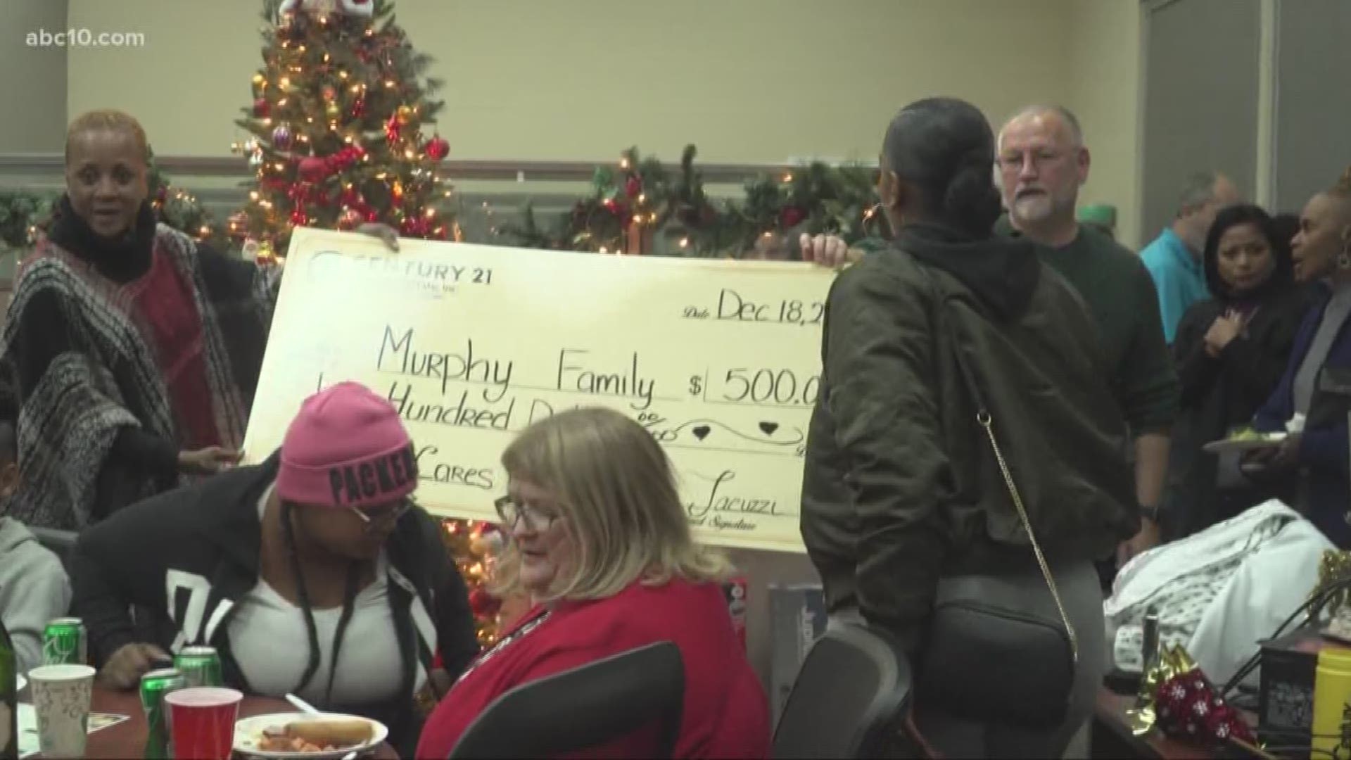 Three families were invited to a Christmas party at Century 21 off Florin Road, but little did they know, there was an even bigger gift to celebrate.