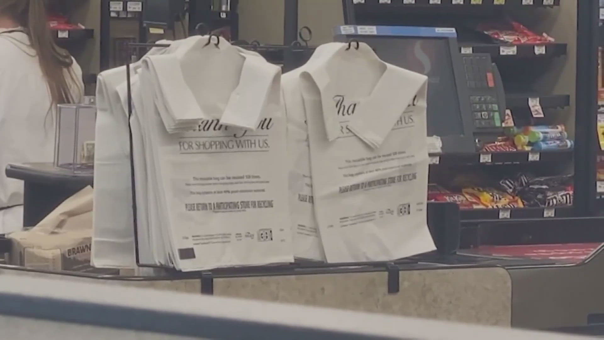 “Paper or plastic” will no longer be a choice at grocery store checkout lines in California under a new law signed Sunday by Gov. Gavin Newsom.