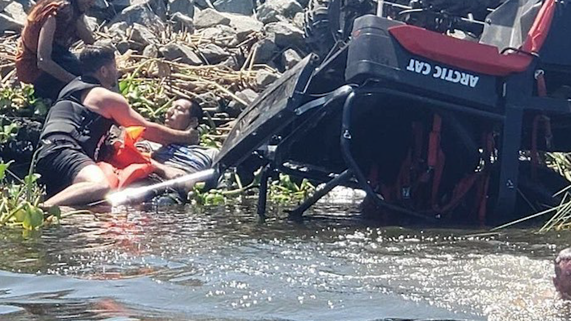The two men were boating on the Delta when they saw an overturned ATV in the water.