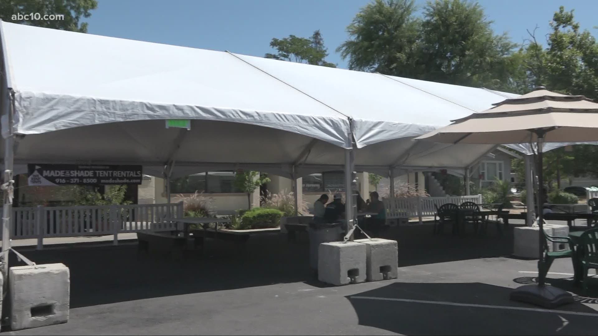 The businesses put up a giant tent in the middle of the street to allow up to 55 guests to dine outside for both food places.