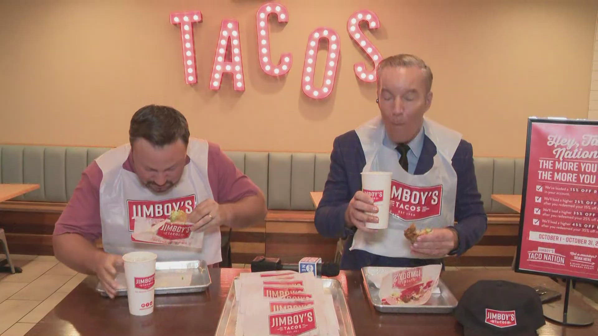 Jimboy's Tacos CEO Erik Freeman races ABC10's Mark S. Allen to finish a taco ahead of the chain's taco-eating contest in celebration of its 70th anniversary.