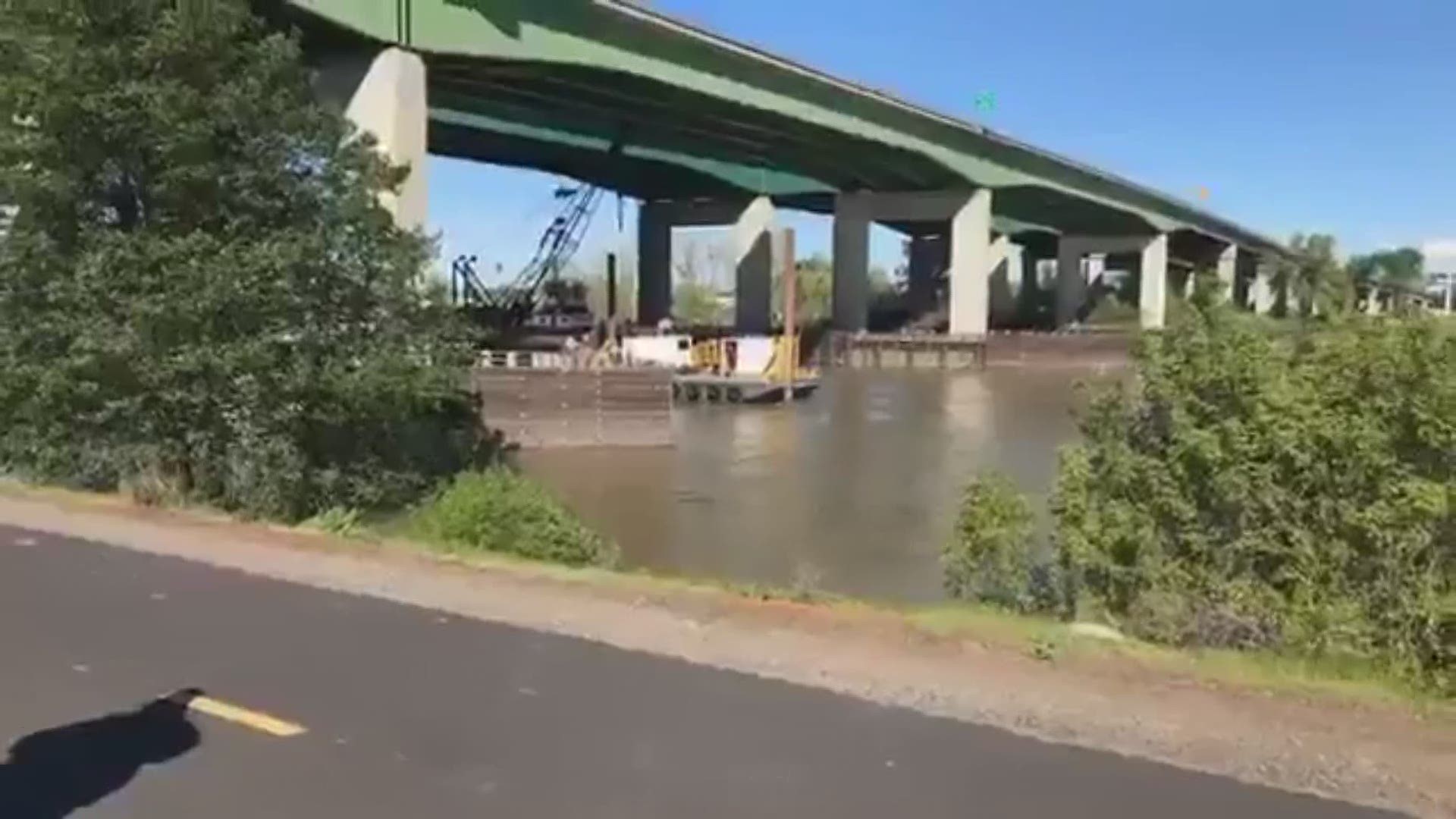 Recovery teams working under Pioneer Bridge were unable to bring the tow truck, which fell into the water on March 26, up to the surface on Friday. They say they will resume their efforts on Saturday morning.
