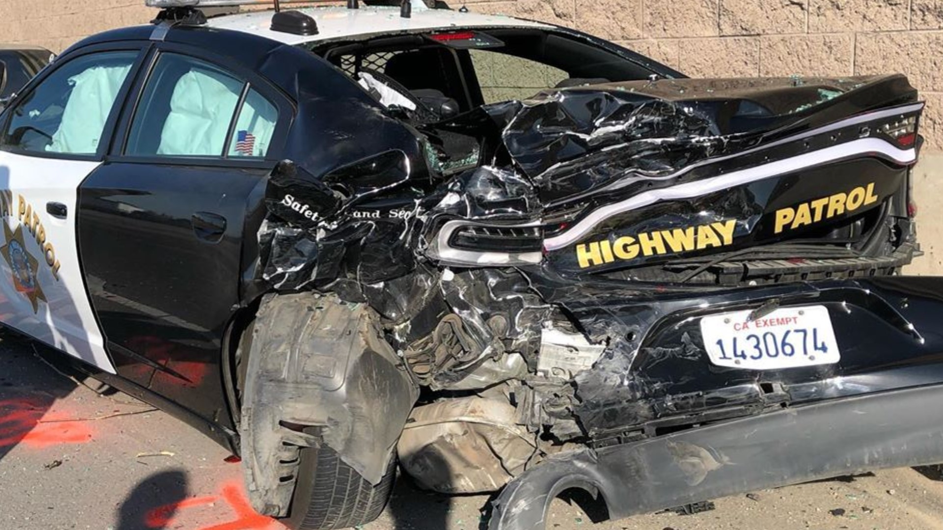 The car swerved around another vehicle before slamming into the patrol car.