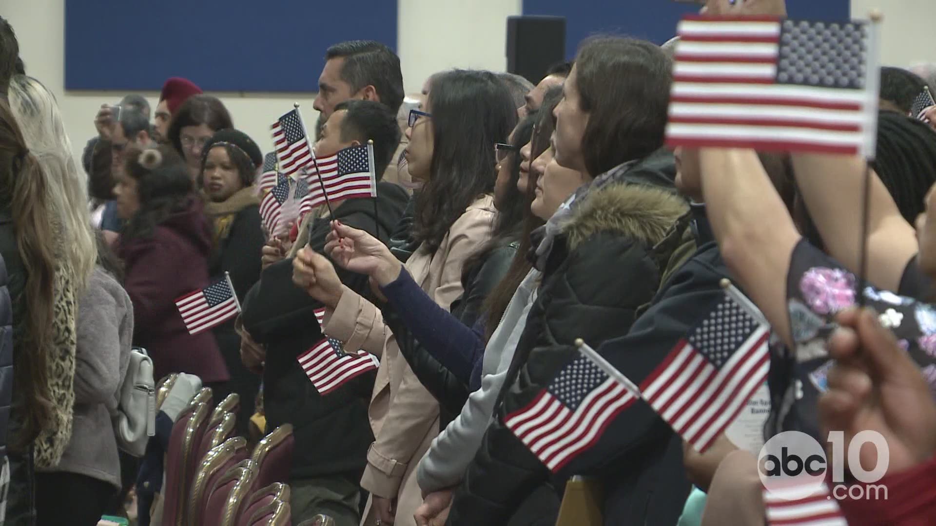 Around 900 people were sworn in as United States citizens Wednesday, in two ceremonies held by U.S. Citizenship and Immigration Services. The proud event happening on day 33 of a partial government shutdown, with a border wall at it's center.