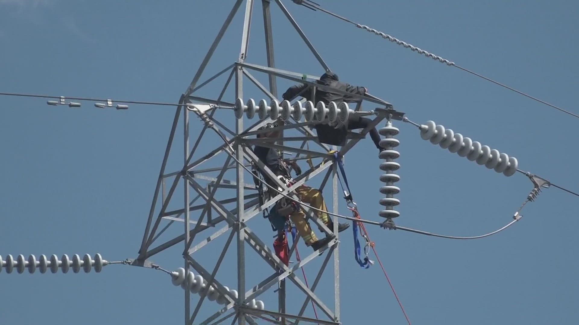 Sacramento Fire is trying to get a woman in her 30s down from a power transmission tower.