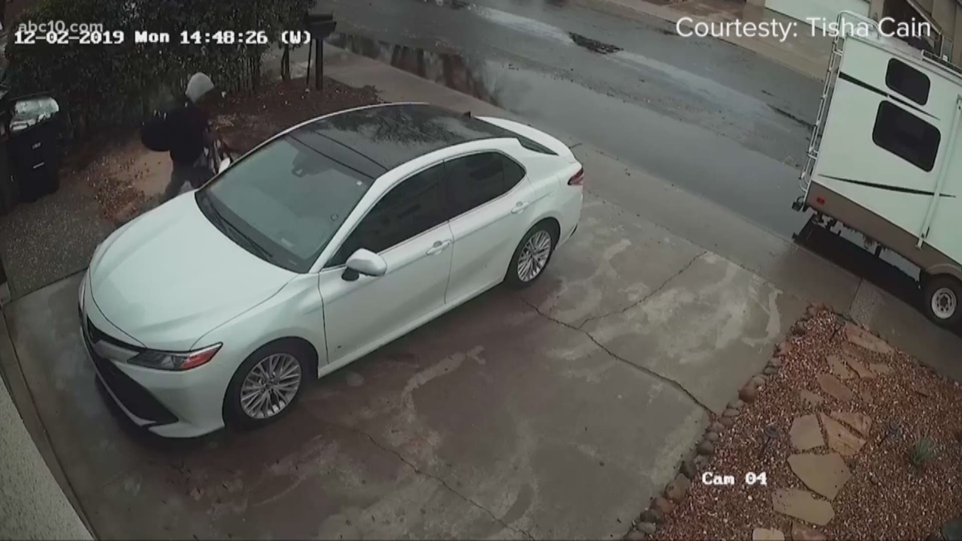 A Modesto homeowner's security camera spots a thief stealing a wallet, checkbook and a baby security blanket from her car that was parked outside of her home.