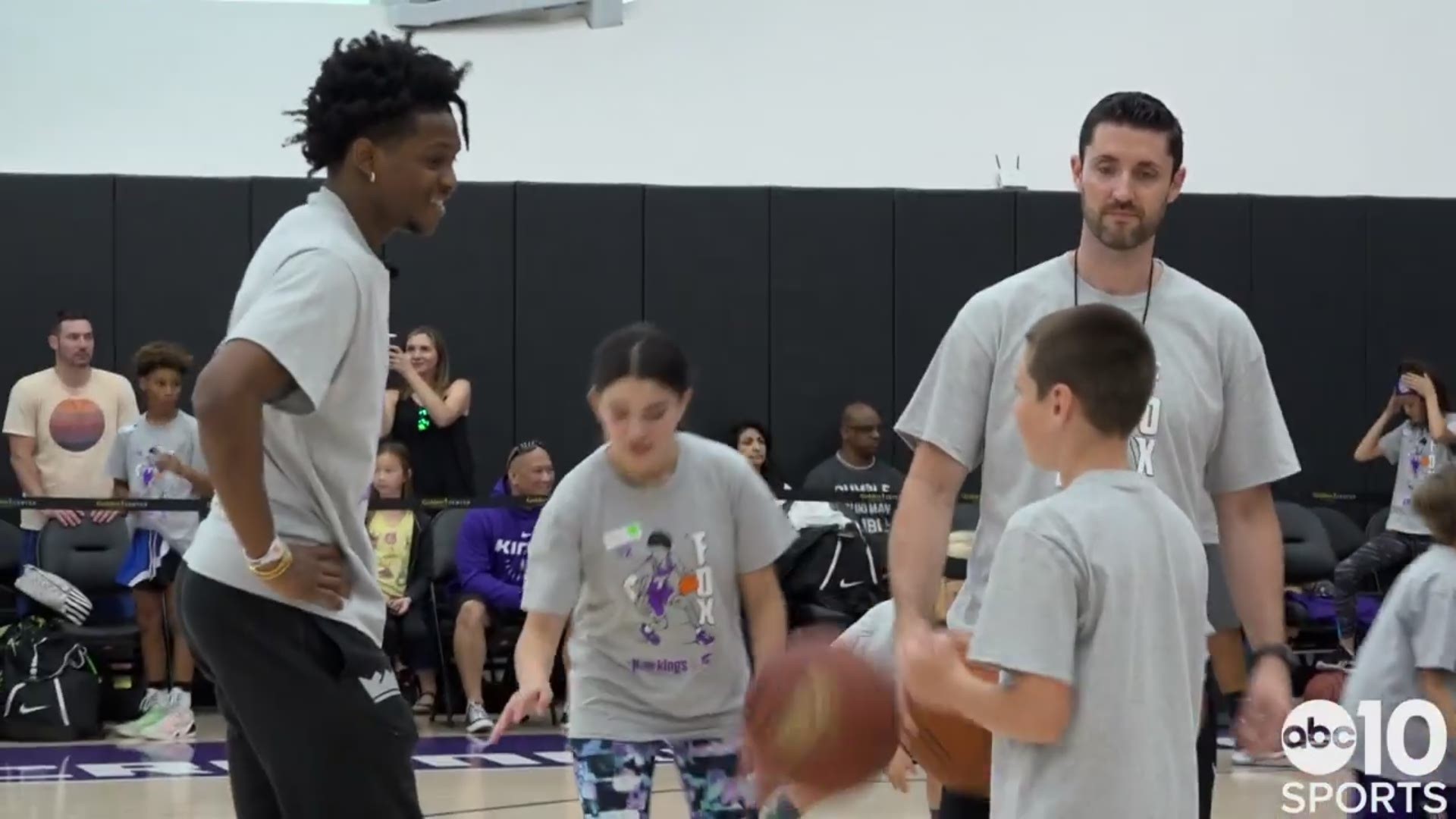 During De'Aaron Fox's basketball camp in Sacramento, the Kings point guard interacts with kids who ask about the team's new coach and even playoff chances for next year. He even teaches one young man a lesson about what happens when you bring a Stephen Curry basketball to his camp.