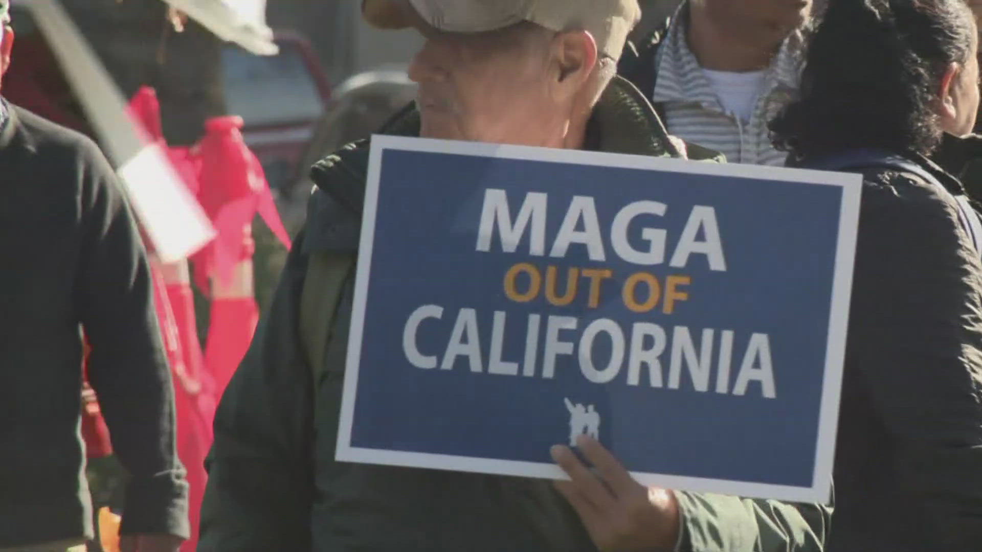 The rally temporarily blocked traffic. Community groups want state leaders to take steps to protect all Californians.