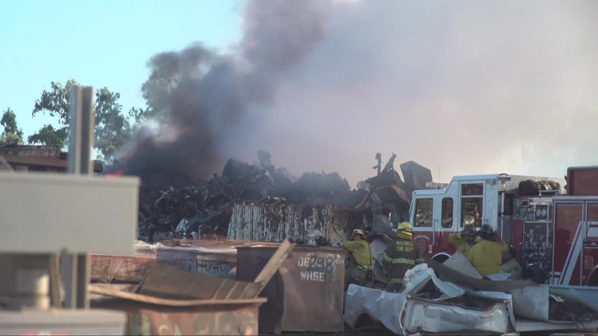 A fire that began in a steel recycling yard continues to burn in Yuba City.
