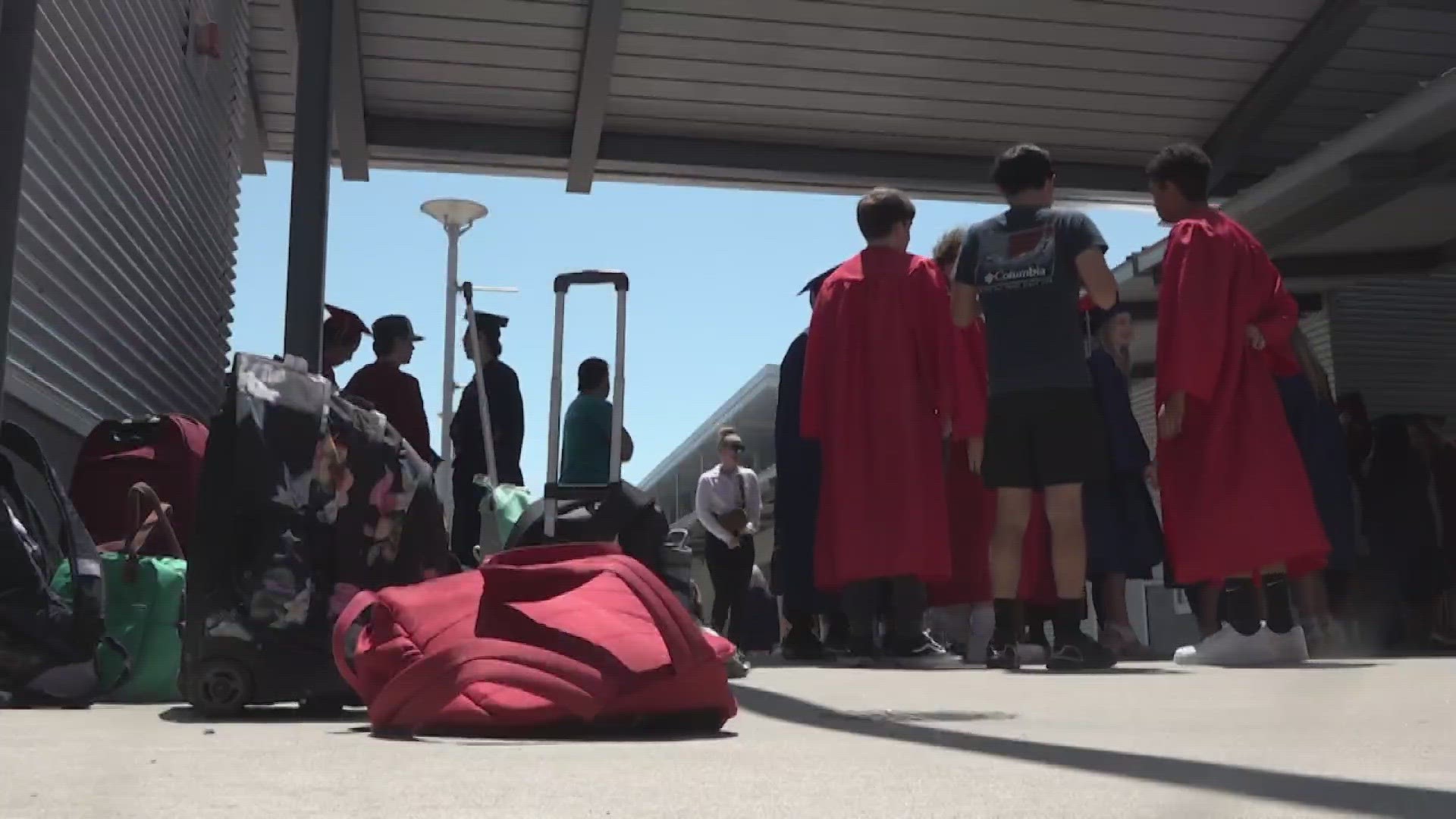 Graduates of Creekview Ranch School alumni lined up beside recent graduates to celebrate on of their lives' greatest achievements.