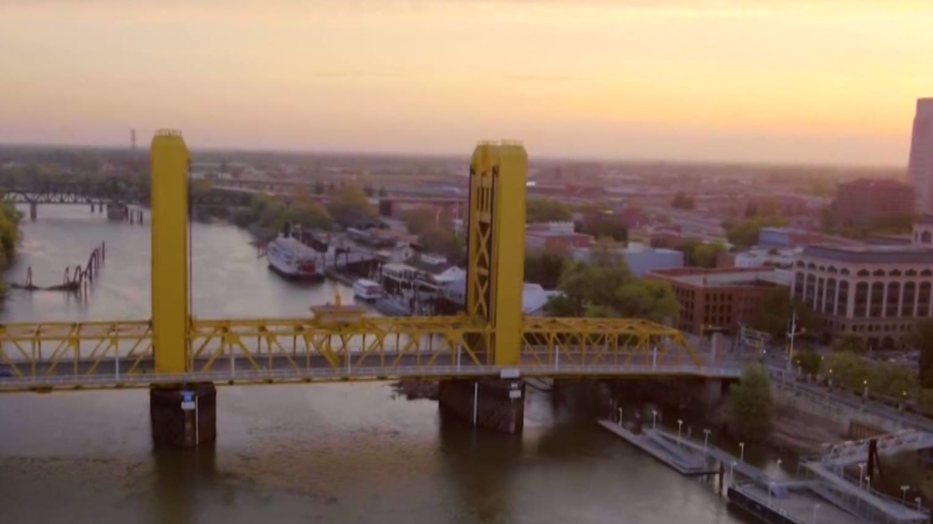 The Tower Bridge in Sacramento. You can't miss it. Since 1935 it's connected Sacramento to Yolo County. It's been painted several times with many colors. Now, it's Metallic Gold. Why?