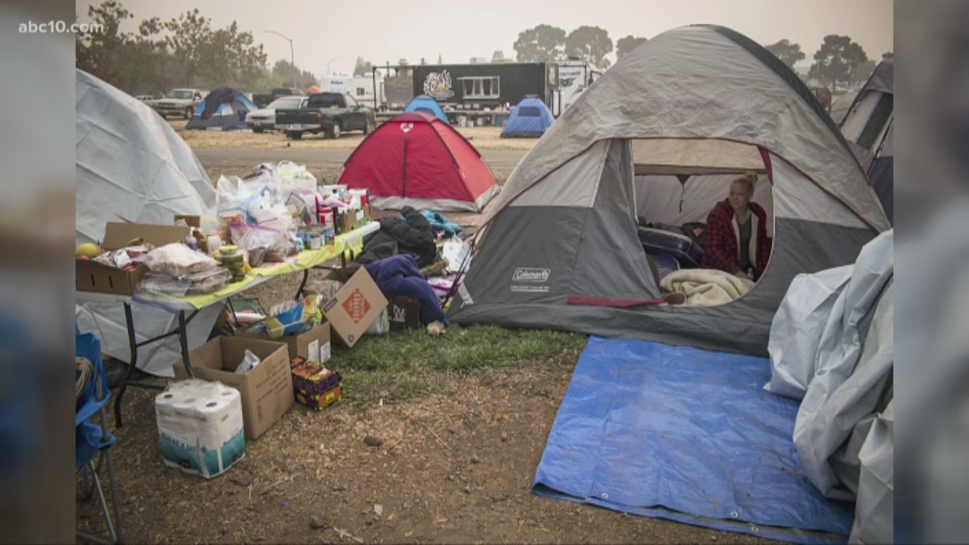 Hundreds of fire refugees are living in tents and makeshift shelters at Walmart parking lot and field next to the store in Chico.
