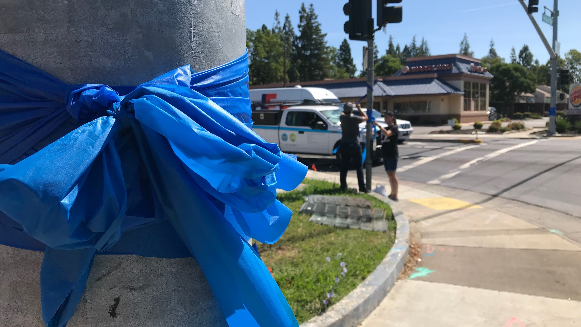 Carole Peak and Sheri Blanco were two of the 40 volunteers who went around placing blue ribbons on street lights, trees, and fences in memory of Officer O’Sullivan.