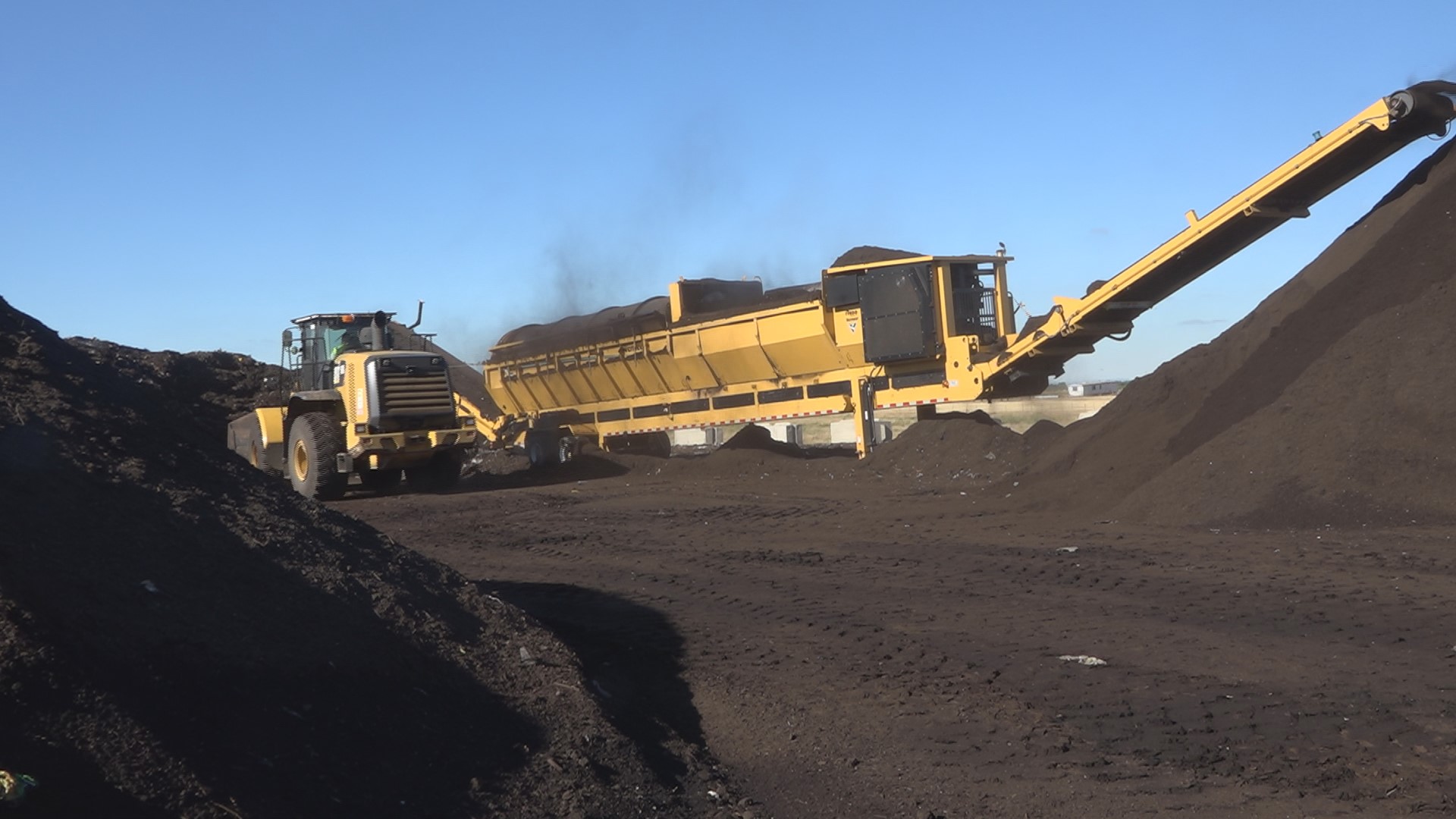Several piles of the rich and earthy compost fill 10-15 acres at the facility. It all starts with your food going into the green waste bin.