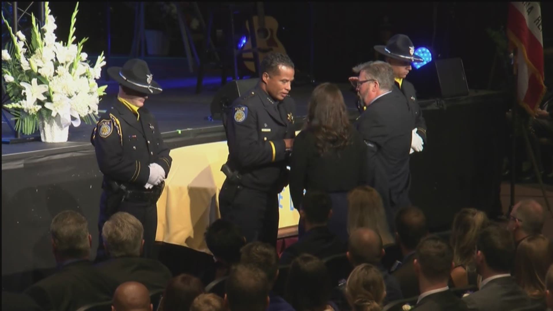 At the memorial for Sacramento Police Officer Tara O'Sullivan, her family is presented with the American flag that had been covering her casket. Sacramento Police Chief Daniel Hahn and the Sacramento Police Department Honor Guard took part in the presentation.