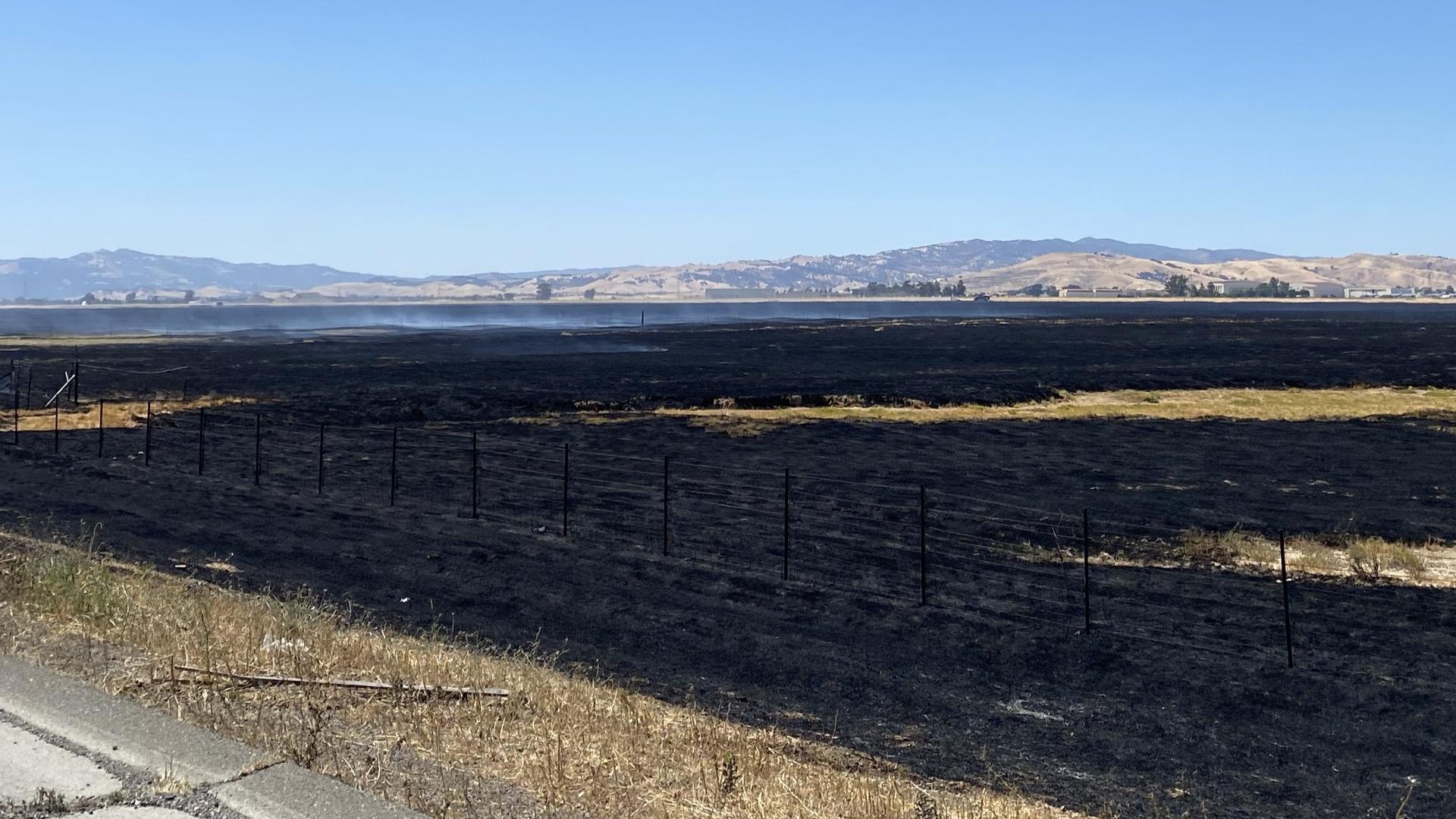 More than 470 acres burned in the fire near Travis Air Force Base as PG&E shut power off for some residents in an attempt to ease fire concerns.