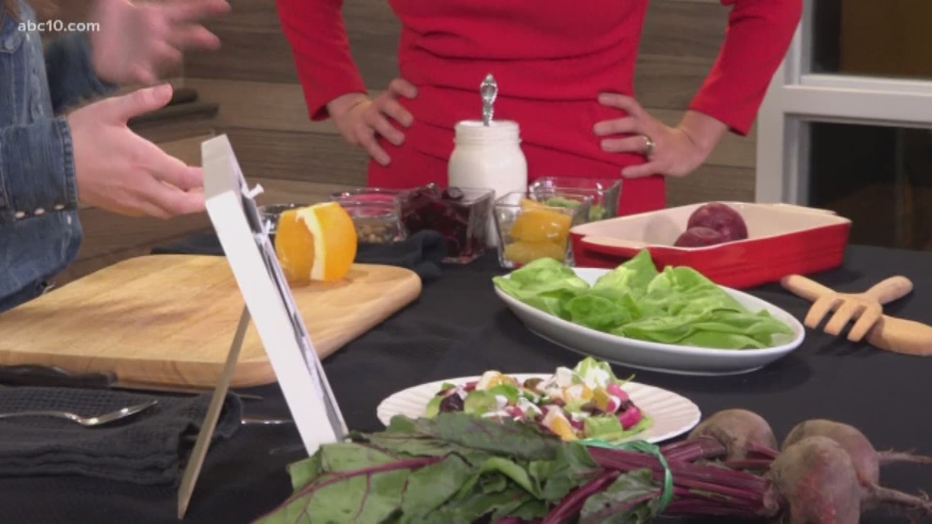 Elisabeth Watkins shows Brittany Begley how to make a roasted beet and orange salad.