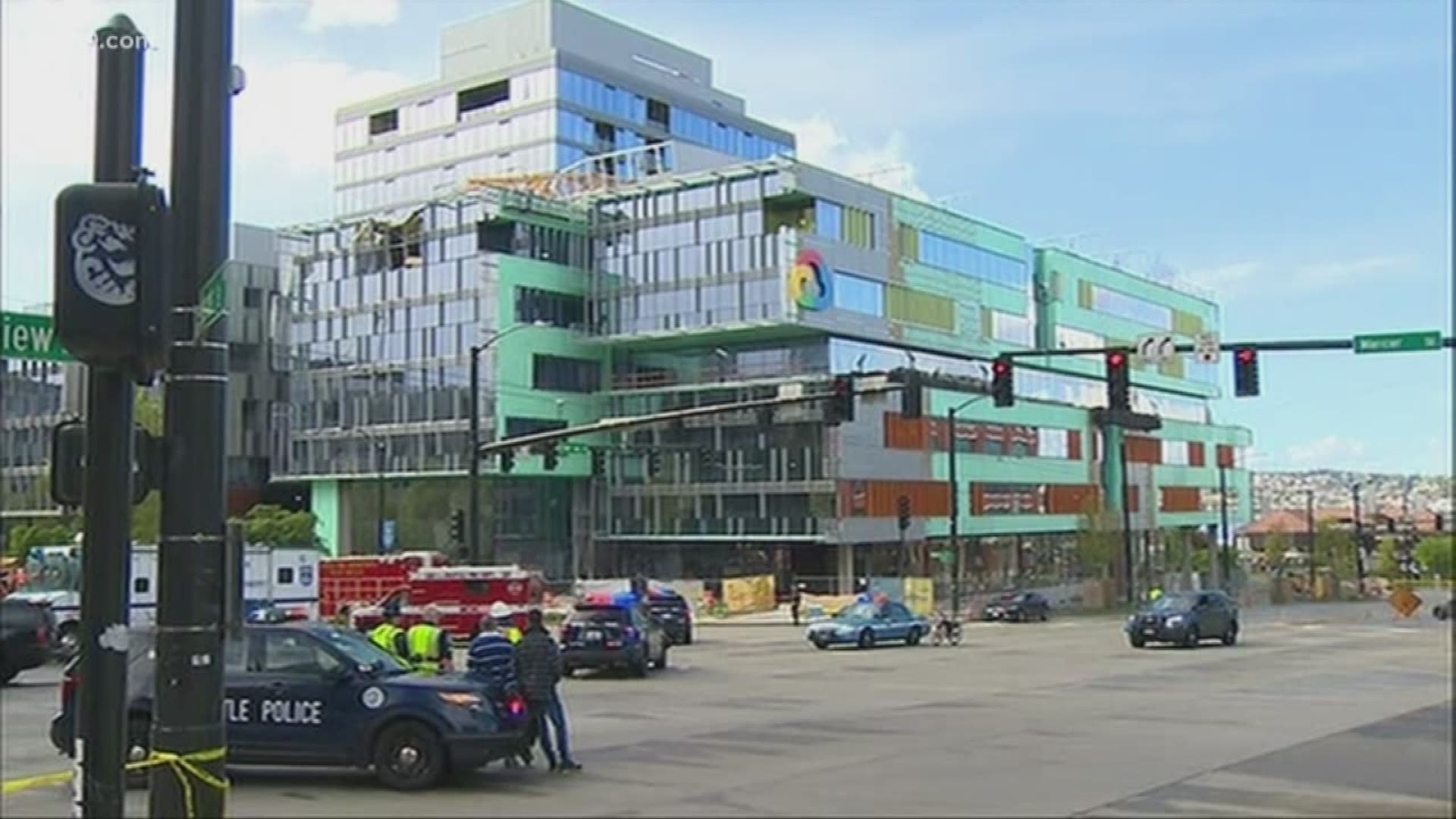 The crane was atop an office building under construction when it collapsed, pinning six cars underneath.