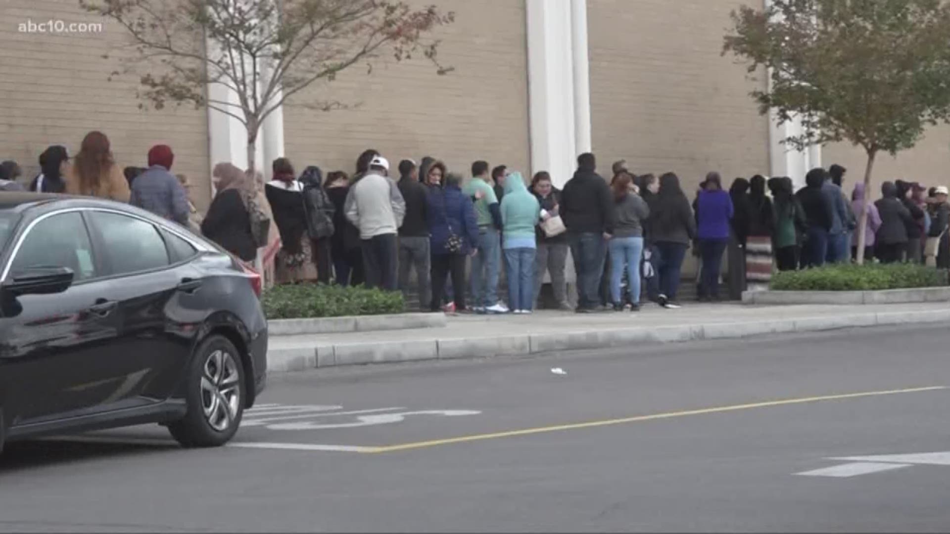 Hundreds of shoppers line up to get their hands on deals.