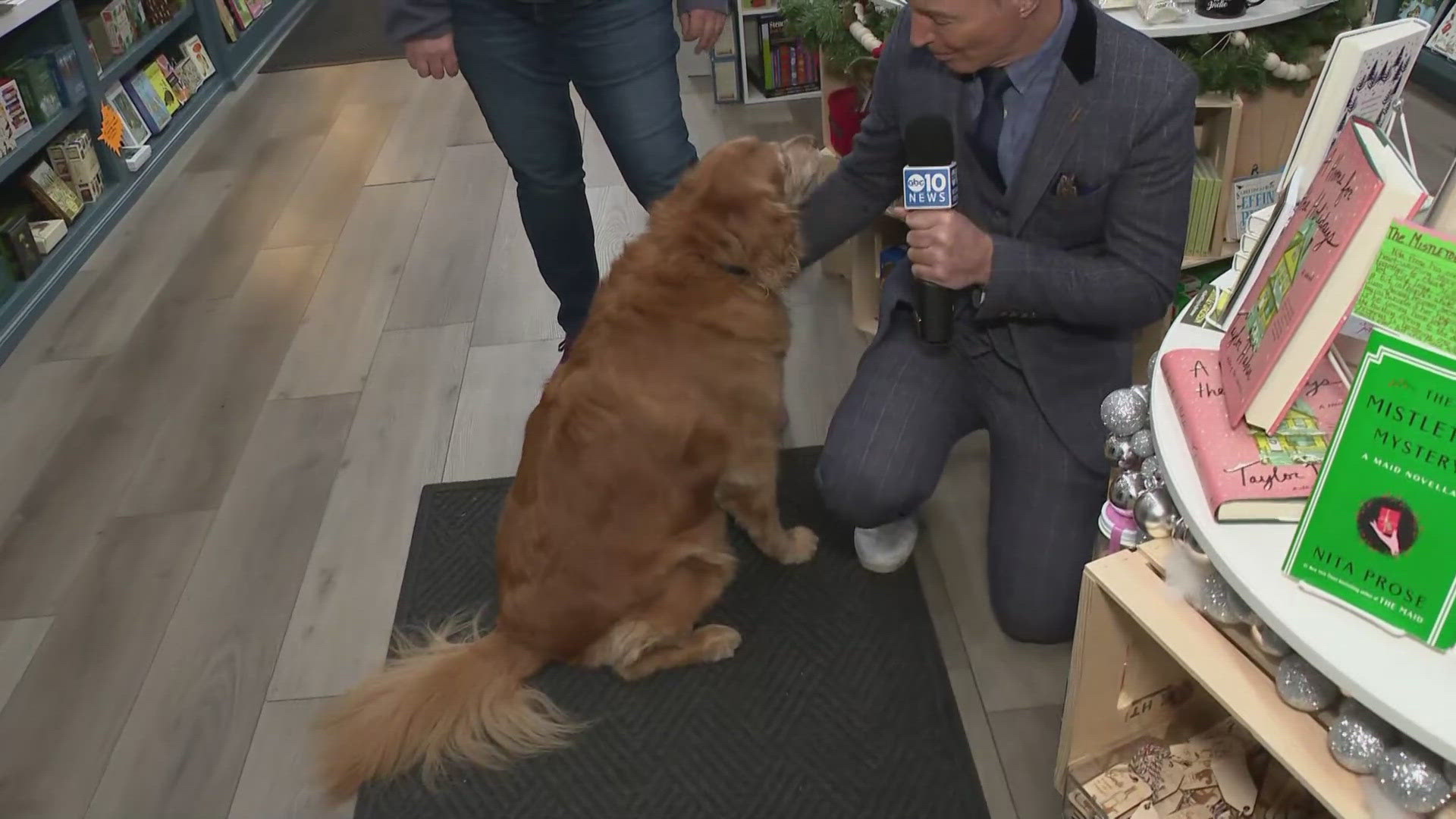 The store's owner invites people to shop for local works while petting Ruby, the store's namesake dog. 