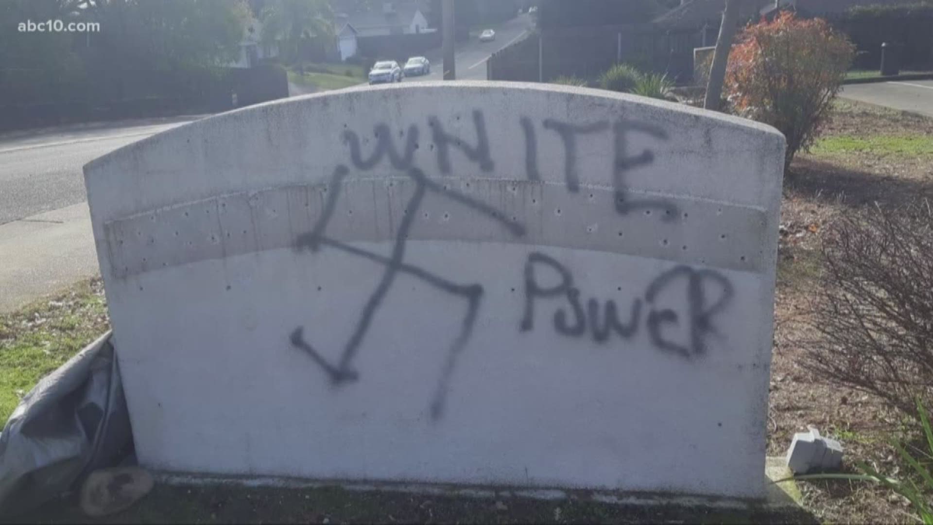 Overnight, someone vandalized a sign in front of the building, drawing a swastika and writing “white power” in spray paint.