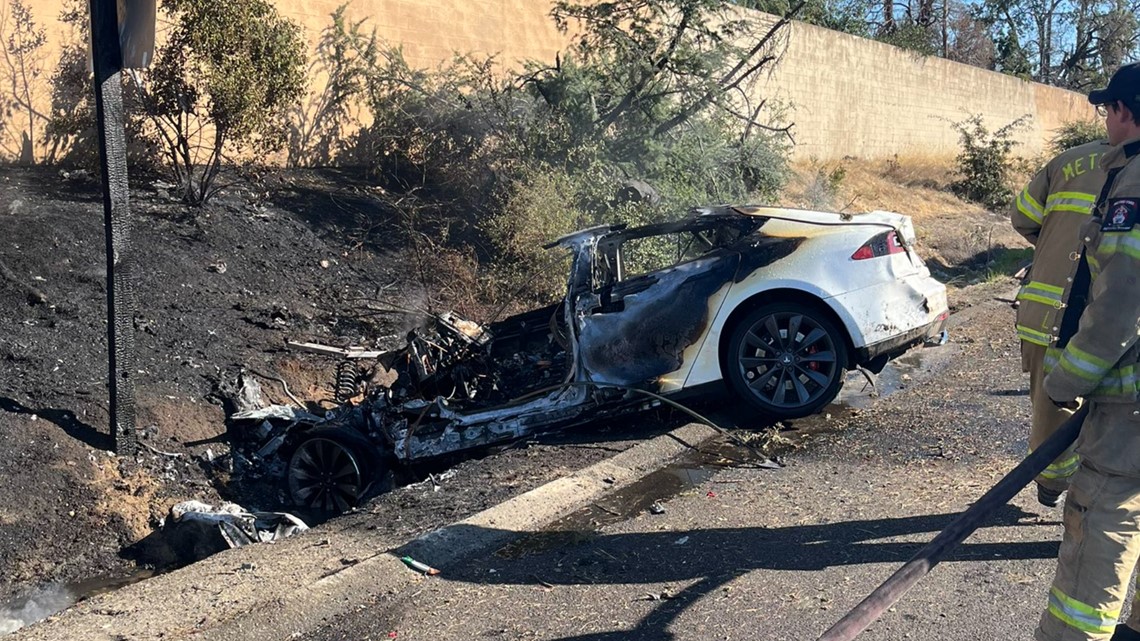 Tesla fire Car burns, ignites shoulder of I80 at Madison Avenue