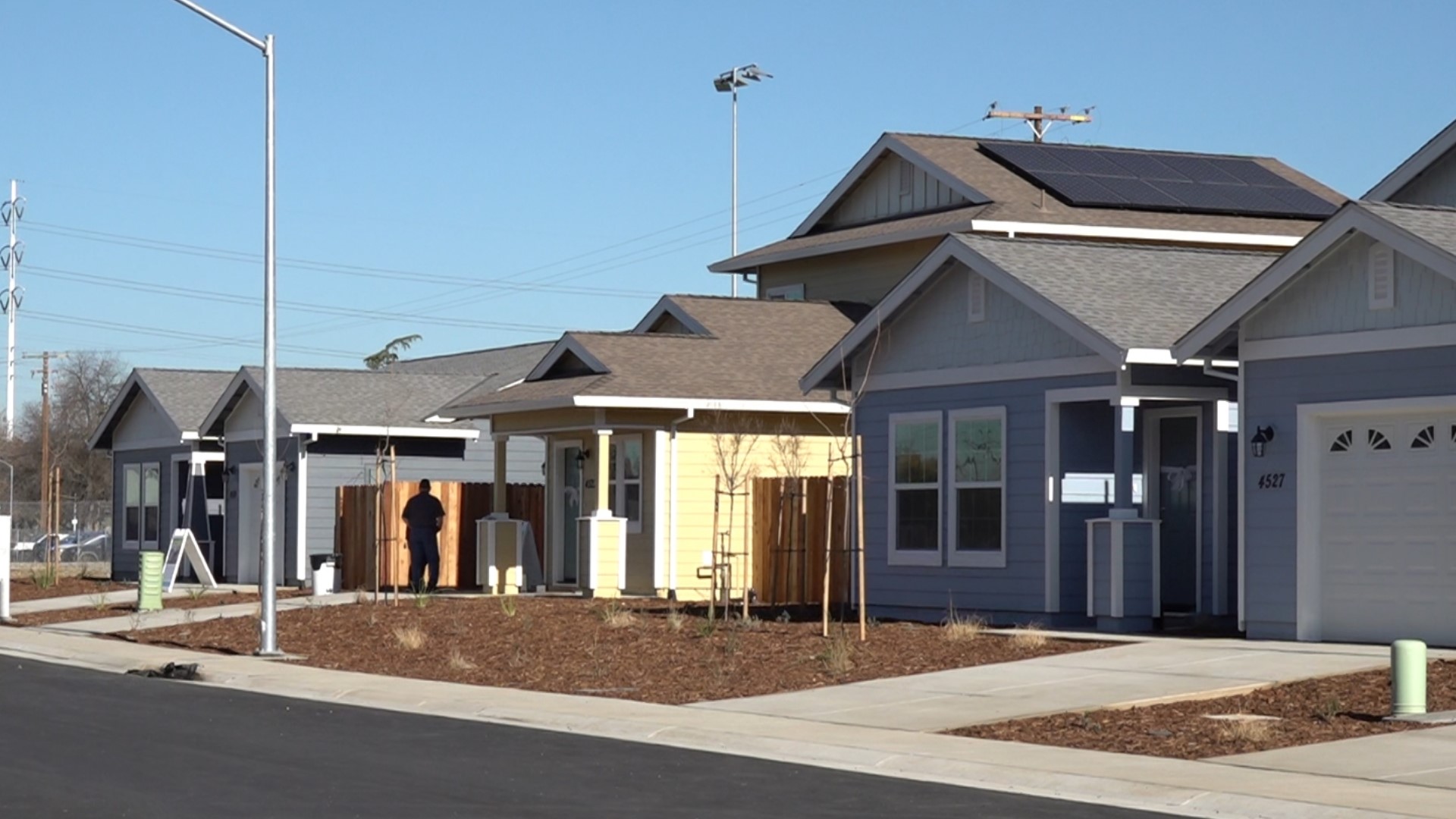 A first of its kind collaborative neighborhood effort let nine families move into their new homes just before the holidays.