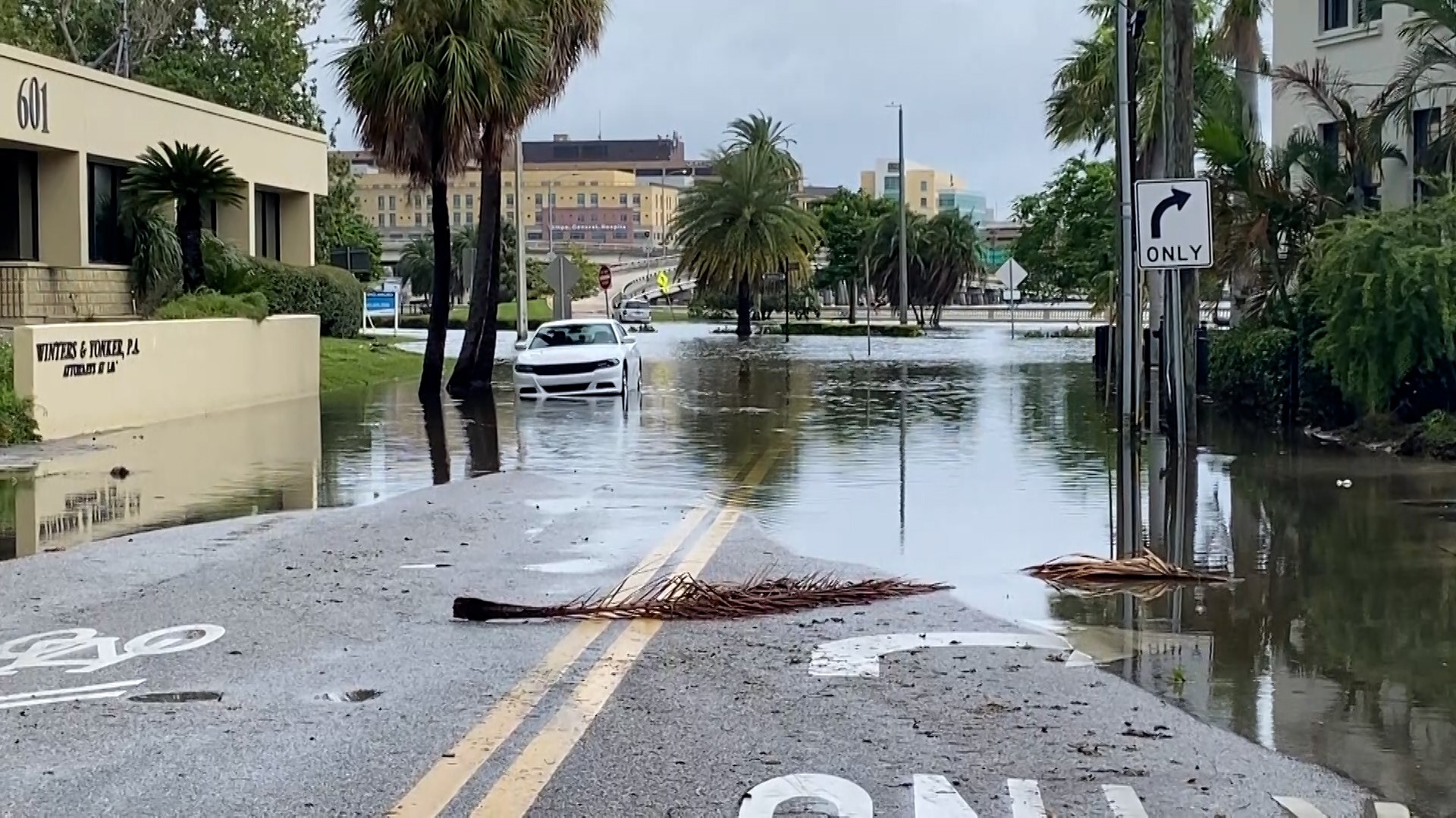 The storm slammed into Florida, ripped roofs off hotels and turned small cars into boats before sweeping into Georgia.