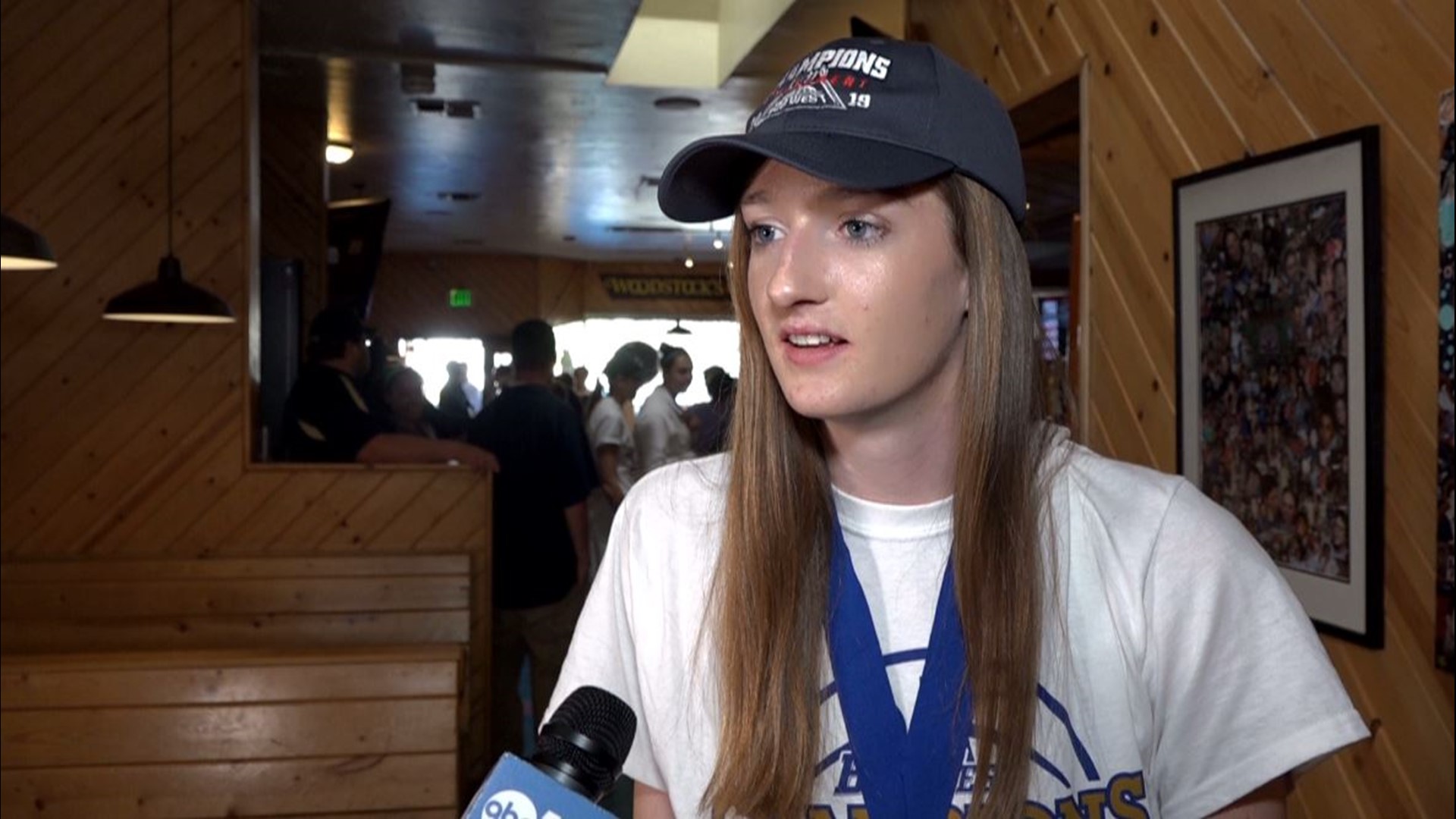 At a Selection Monday celebration at Woodstock's Pizza for the UC Davis Aggies women's basketball team, celebrating their Big West Conference Championship title, head coach Jennifer Gross speaks at the party looking ahead to Saturday's matchup with Stanford.