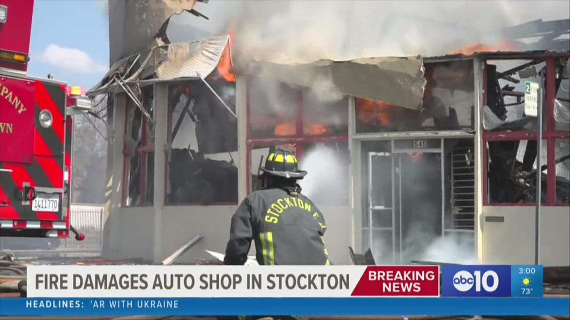 The fire erupted at a shuttered auto shop near Hunter and Oak Streets in downtown Stockton just before noon Thursday, sending up a column of black smoke.